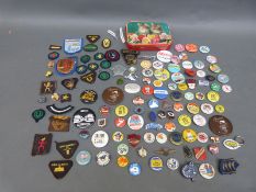 A quantity of badges to include Sex Pistols, The Beatles Fan Club, tourist, advertising etc.