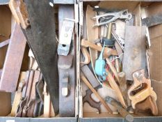 A collection of vintage woodworking tools including large block planes,