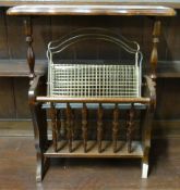 An oak magazine rack together with a brass example