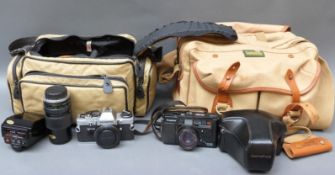 A quantity of Olympus SLR camera equipment to include OM-4, OM10, 75-150mm 1:4, 135mm 1:3.