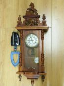 A Vienna regulator style two train wall clock and a gas Fairy Prince iron