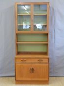 A retro glazed G Plan bookcase with shelf under,