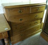 A pine chest of drawers 2 over 3 drawers with brass handles (H97 x W105 x D43cm)