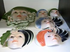 A collection of Crown Devon wall plaques