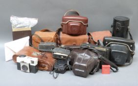 A quantity of collectable camera to include Olympus OM10 with 1:1.8 f = 50mm and 1 35mm 1:3.