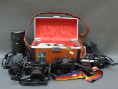 A quantity of cameras and accessories to include Nikon N2020 SLR, Centon DF-300 SLR,