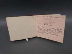 An autograph album, includes good pencil drawing Castle Combe 1942 by W J Packer,
