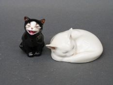 A Royal Doulton cat 'Lucky' K12 and a Royal Copenhagen sleeping cat numbered 178 to underside