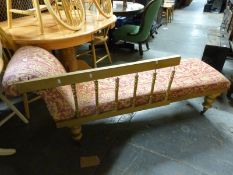 A gilt framed upholstered chaise longue