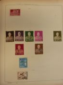 A collection of world stamps in two Schaubek albums