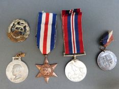 Two WWII medals comprising 1939-45 medal and a France and Germany star in box marked Ron Smart,