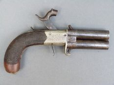 Percussion hammer action over and under pistol with engraved locks, and butt cap, folding trigger,