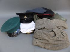 A quantity of military or similar caps,
