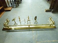 A brass fire kerb with rope twist decoration,