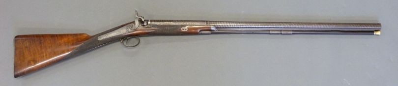 Williams & Howell percussion hammer action gun with lock named and engraved with countryside scenes,
