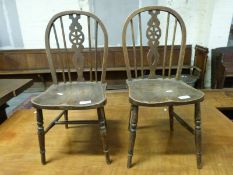 A pair of elm-seated children's chairs,