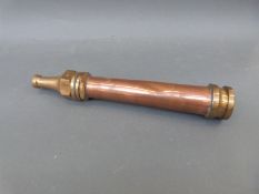 A vintage copper and brass fire hose nozzle impressed John Morris, Fire Snow Ltd, Stockport,