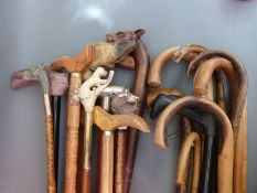 Approximately 20 various walking sticks including carved dog example,