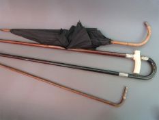 A hallmarked silver-mounted ivory-handled walking cane,