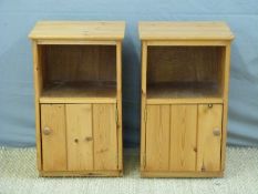 A pair of pine bedside cabinets,