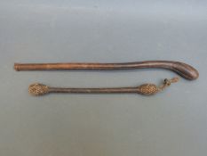 Two worked leather priests or coshes, one braided, double-ended and weighted,