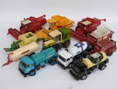 Eleven Britains 1:32 scale model agricultural vehicles including combine harvesters, milk tankers,