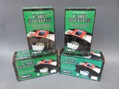 A quantity of boxed card shuffling machines,