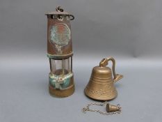An Eccles miner's lamp and a brass bracket door bell