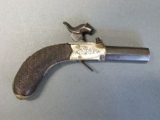 Percussion hammer action pistol with engraved steel lock and top plate, folding trigger,