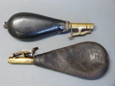 Two leather and brass shot flasks one by James Dixon & Sons with embossed decoration of a rural