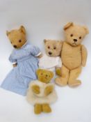 Three large blonde mohair Teddy bears together with a Merrythought bear hand muff,