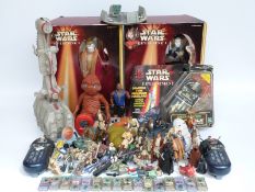 A large collection of Star Wars and similar figures and spaceships,
