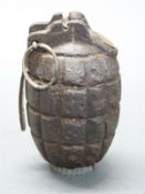 British WWI inert Mills bomb No36M MK1 'pineapple' grenade, 10cm long.