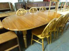 A pine extending table and six chairs,
