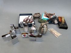 A quantity of novelty and other lighters including Ronson and Zippo