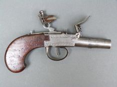 Flintlock hammer action pistol with engraved lock named Velu, thumb slide safety,