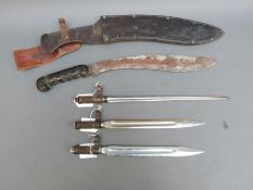 Three small bayonets possibly for training,