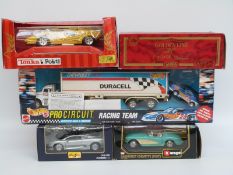 Five Maisto, Burago, Mira and Hot Wheels diecast model vehicles and vehicle sets,