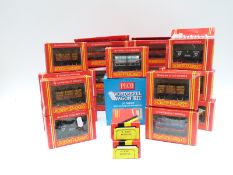 Nineteen Hornby 00 gauge wagons, together with two PECO wagon kits,