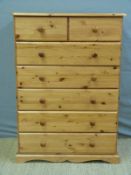 A pine chest of two over five drawers,