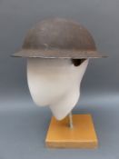 A WWII British military helmet stamped F & L BZ35 1940