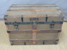 An ash and metal bound trunk with leather handles,