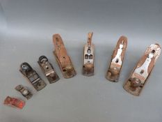 A quantity of woodworking planes to include Stanley 220, 120,