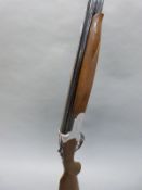 Lanber 12 bore over and under ejector shotgun with scrolling engraving, chequered semi-pistol grip,