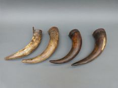 Four probably 17th/early 18thC cowhorn powder horns