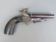 Percussion hammer action side by side pistol with engraved locks and top plate,