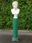 A decorative bust on malachite effect column,