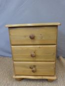 A pine bedside chest and set of shelves,