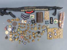 A collection of military badges,