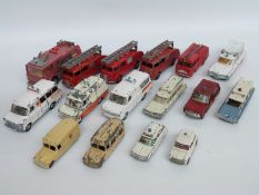 Sixteen Dinky Toys diecast model emergency vehicles including police,